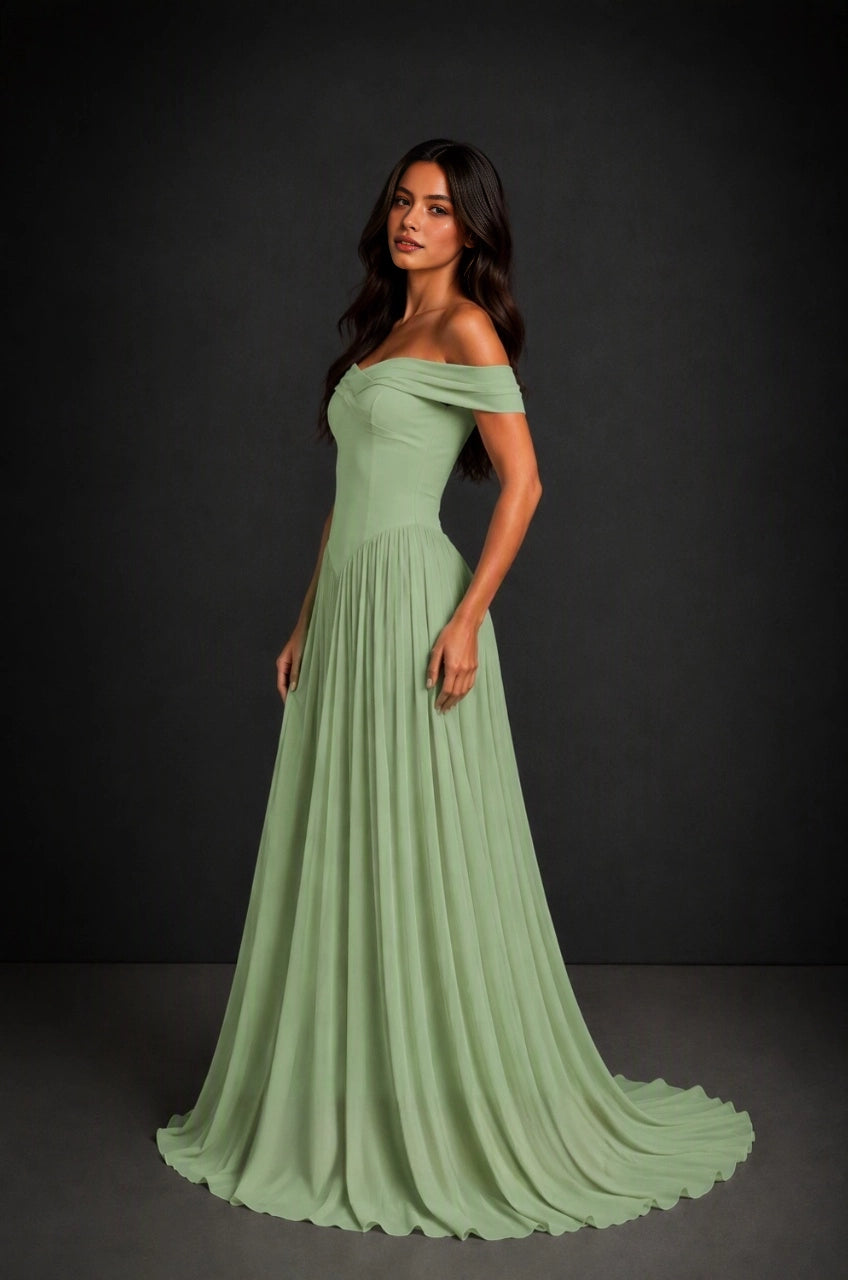 Back view of Vedress sage green bridesmaid dress with crisscross corset lacing, a waist bow and a flowing floor-length skirt.